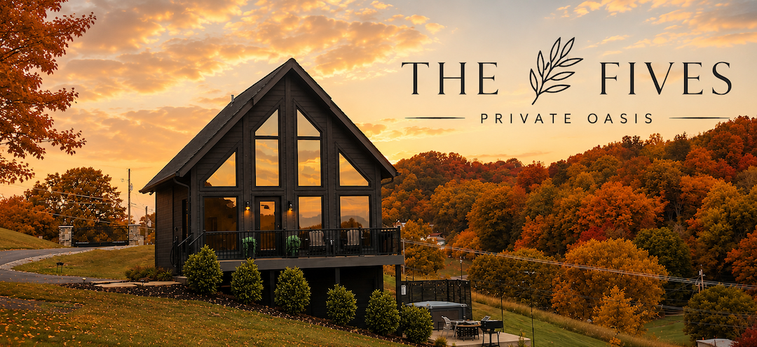 Luxury A-frame cabin at sunset overlooking vibrant fall foliage, branded The Fives Private Oasis.