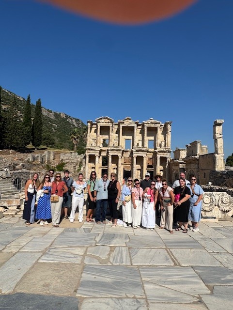 Southwest Community standing in front of a ruin in Greece