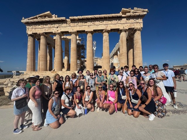 Southwest Community Standing in front of a ruin in Greece