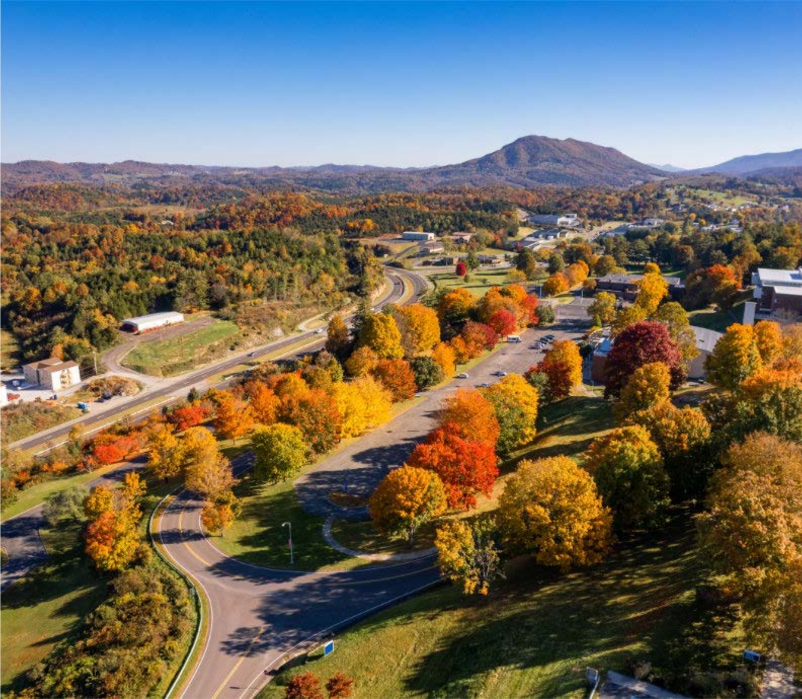 Aerial view of Southwest Virginia Community College surrounded by colorful autumn trees and rolling mountains.