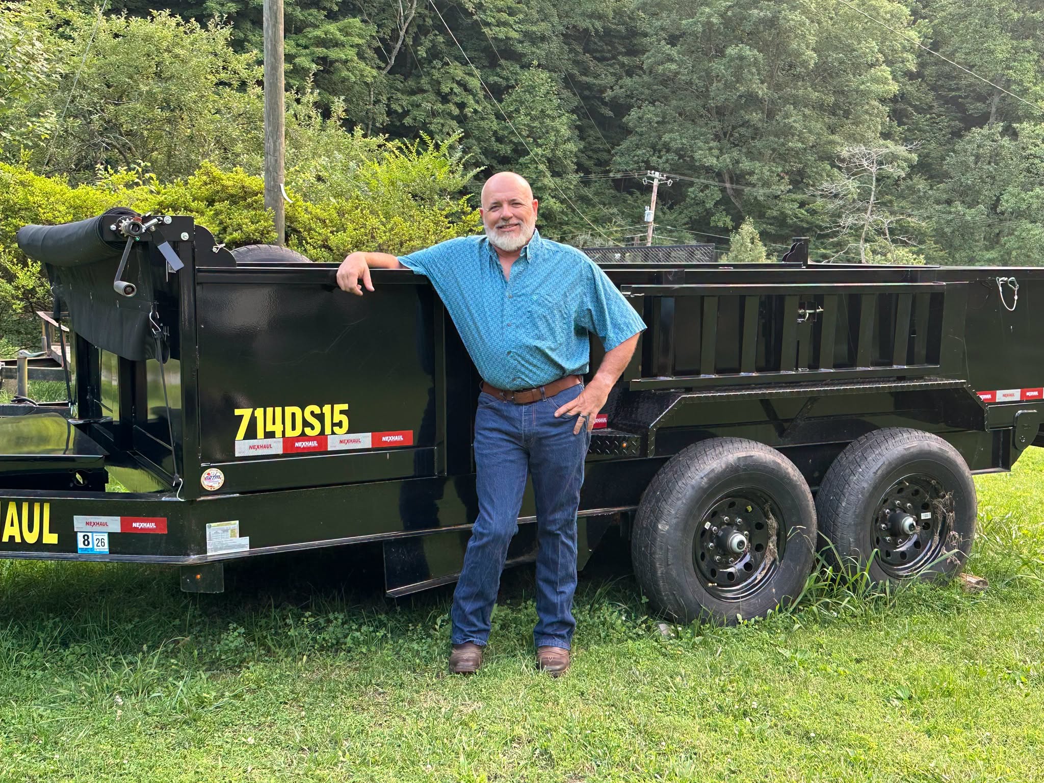 Owner standing next to trailer