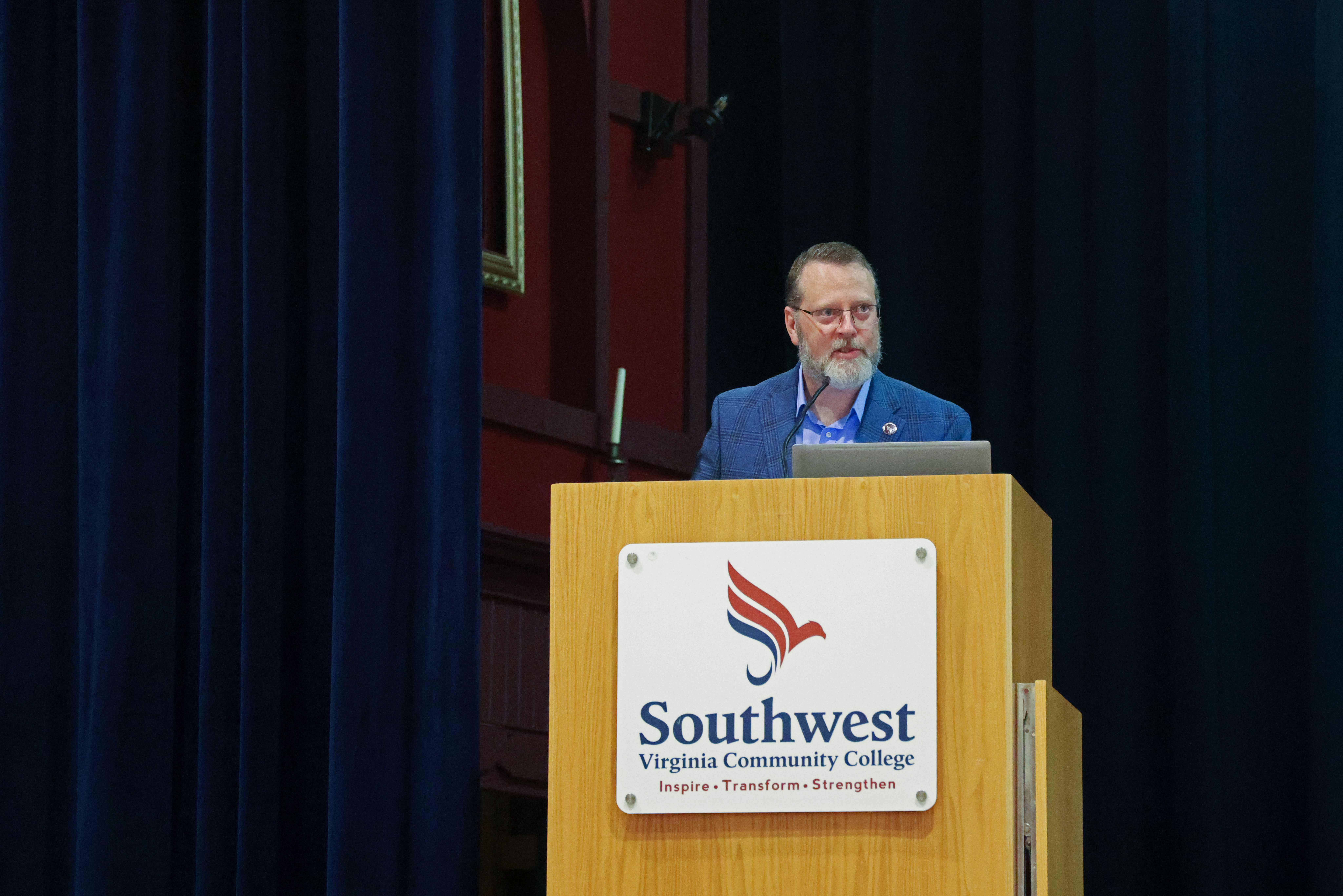 Dr. Clint Hayes standing at a podium