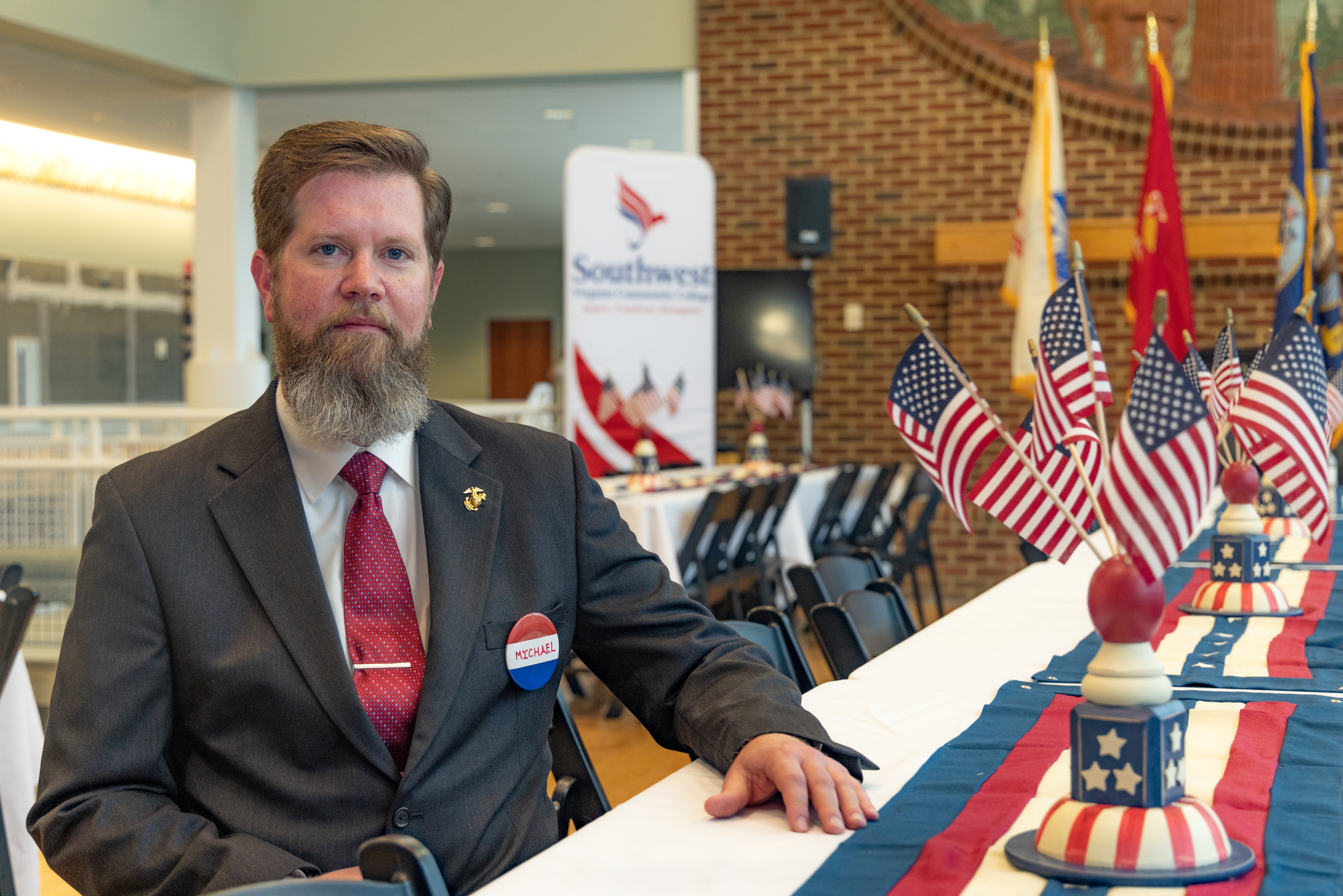 Michael Herndon in Suit at a table